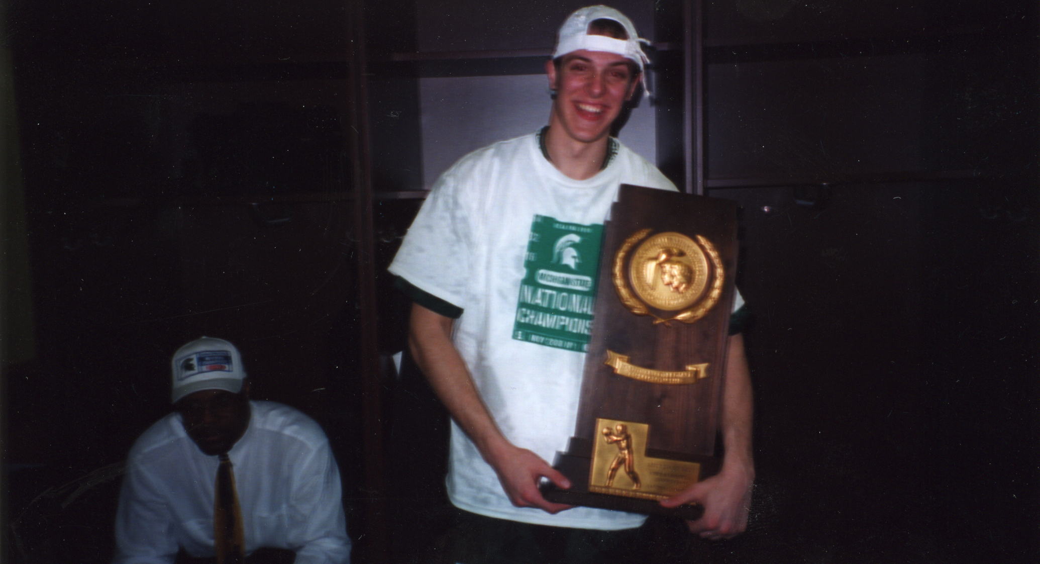 Adam Wolfe holding the 2000 NCAA National Championship trophy
