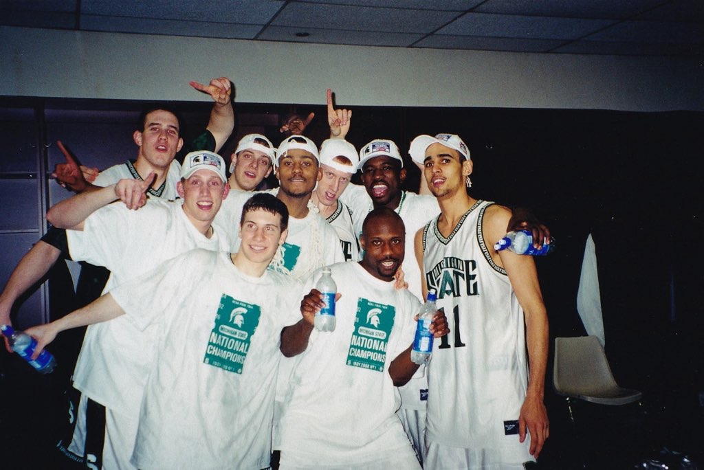 Michigan State teammates celebrating in the locker room after winning the 2000 National Title