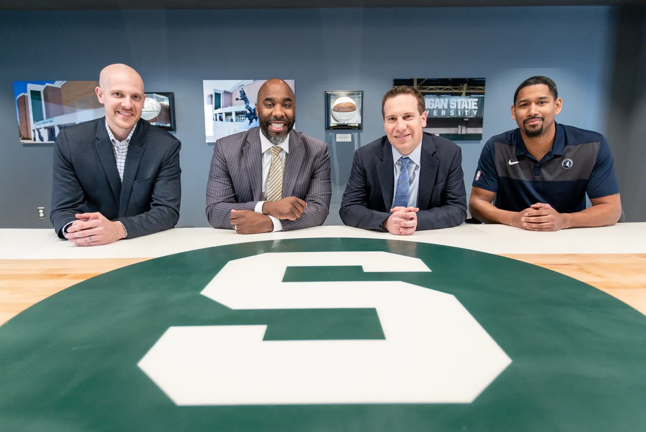 Adam Wolfe, Mateen Cleaves, Mat Ishbia, and Charlie Bell at the Spartan table at United Wholesale Mortgage