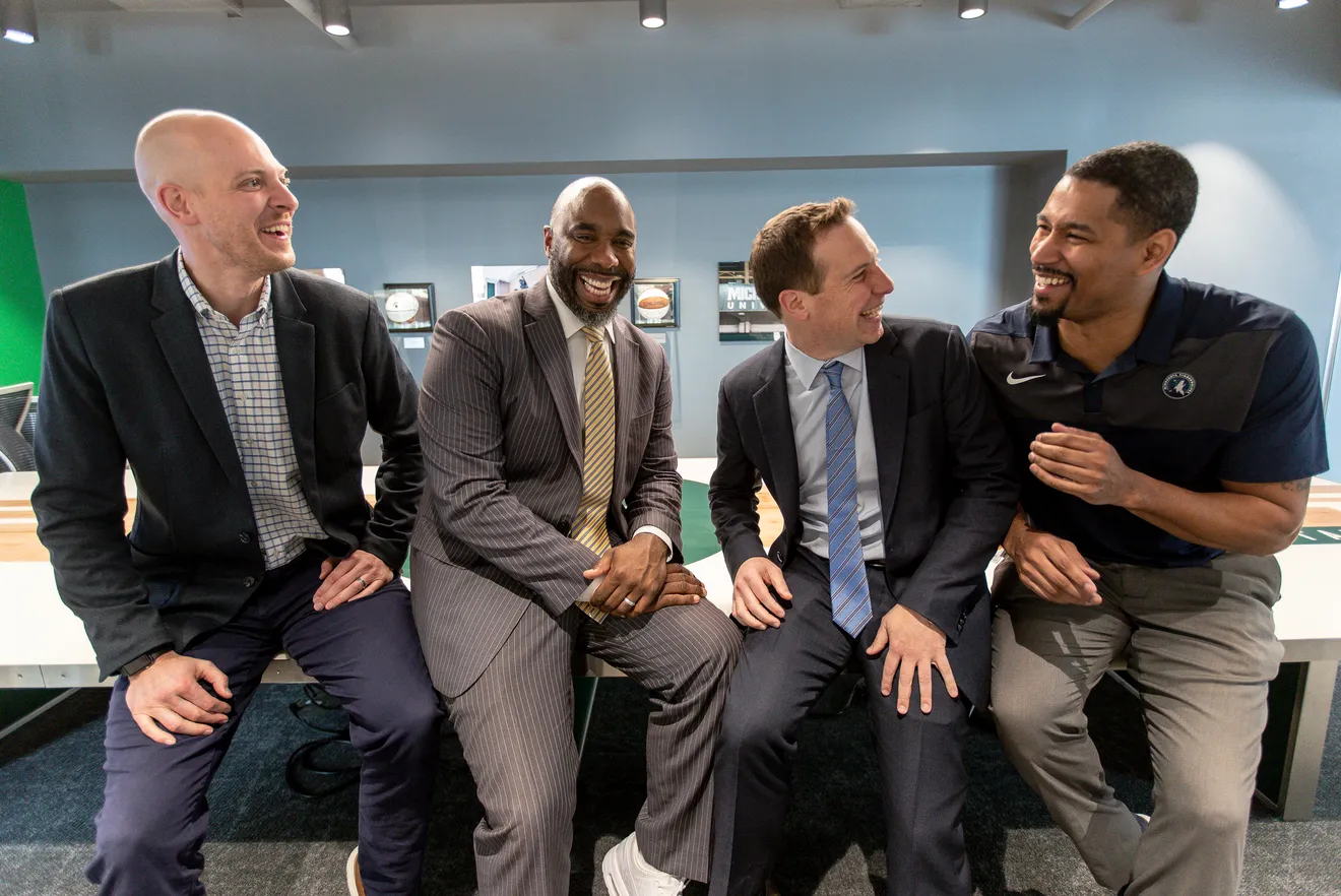 Adam Wolfe, Mateen Cleaves, Mat Ishbia, and Charlie Bell sharing a laugh at UWM